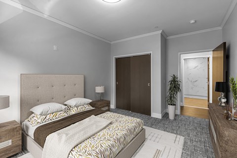 a bedroom with a bed and a door to a bathroom at Nineteen North Apartments , Buffalo, 14202